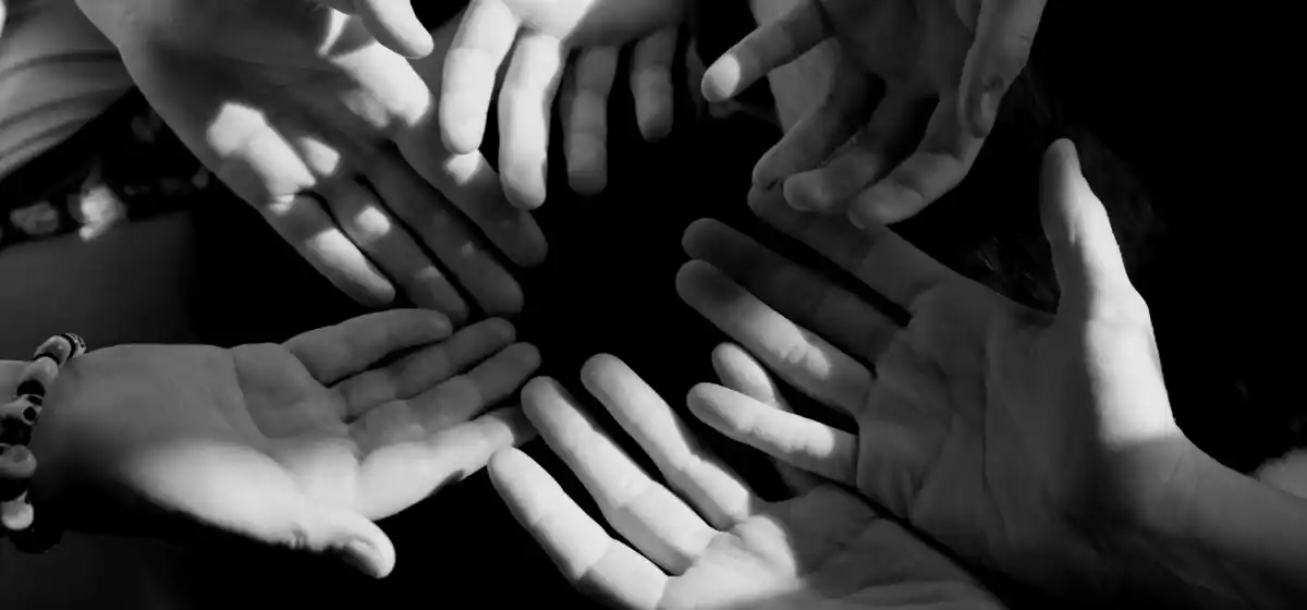 Hands joined in a circle of support