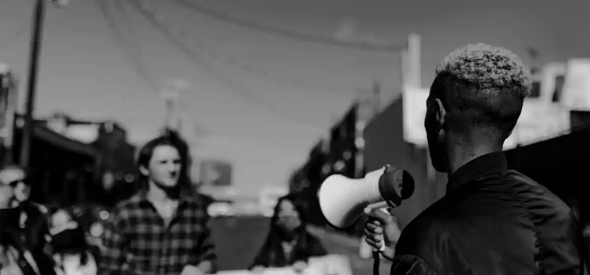 An advocate speaking through a megaphone