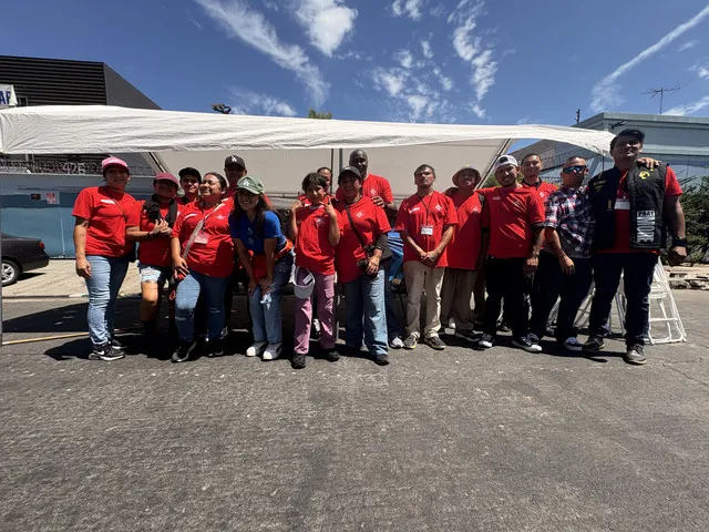 HLAT volunteer team in matching red shirts